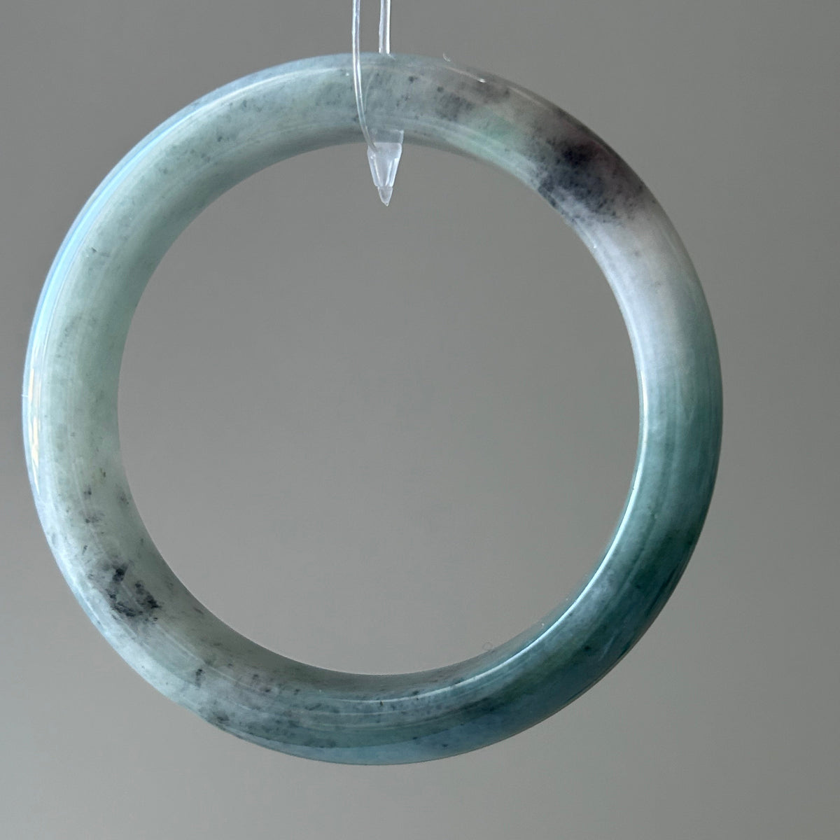 Floating green Burmese jadeite bangle with black chicken (wuji), 58.6mm - Luxe Jadeite