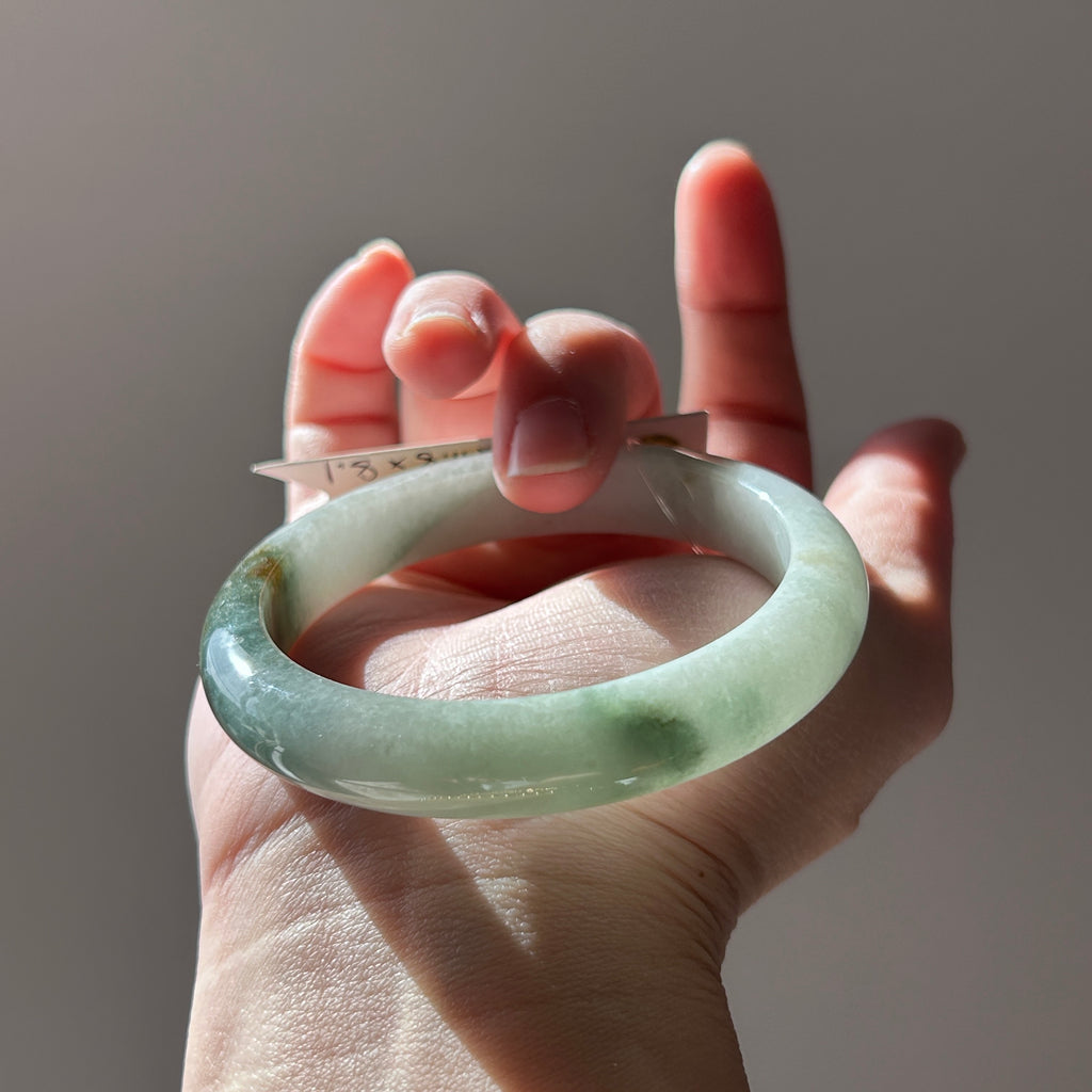Floating green Burmese jadeite bangle with sa jin gold dust, 58.7mm, photo 1 - Luxe Jadeite