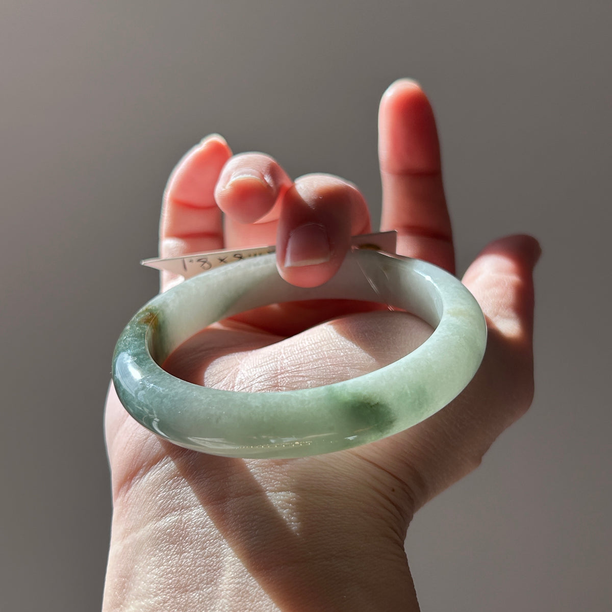 Floating green Burmese jadeite bangle with sa jin gold dust, 58.7mm, photo 1 - Luxe Jadeite