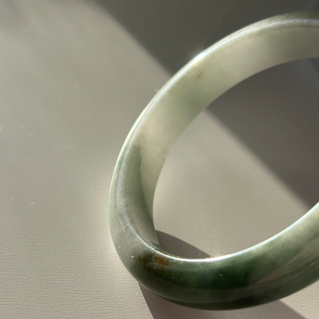 Floating green Burmese jadeite bangle with sa jin gold dust, 58.7mm - Luxe Jadeite