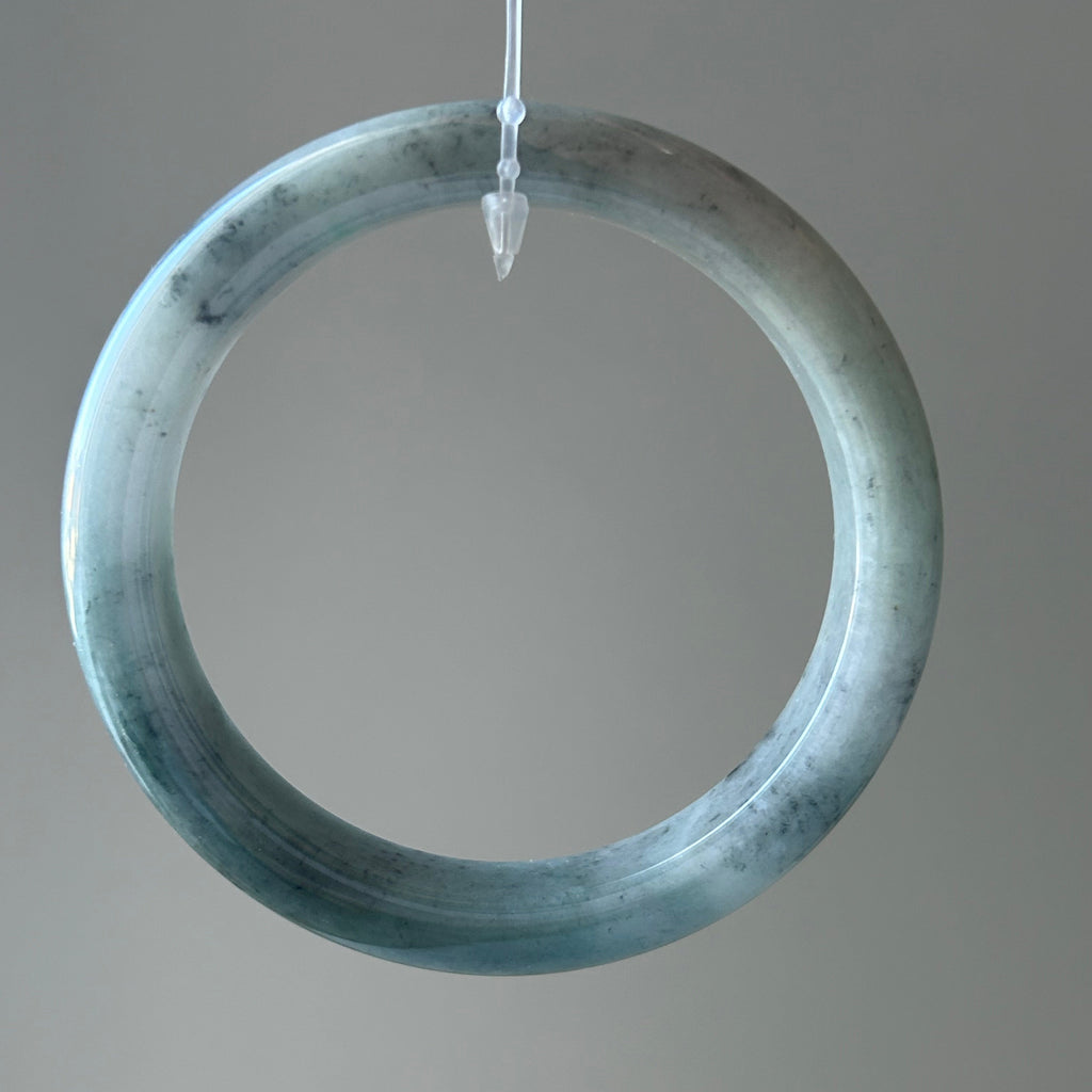 Floating green Burmese jadeite bangle with black chicken (wuji), 58.6mm - Luxe Jadeite