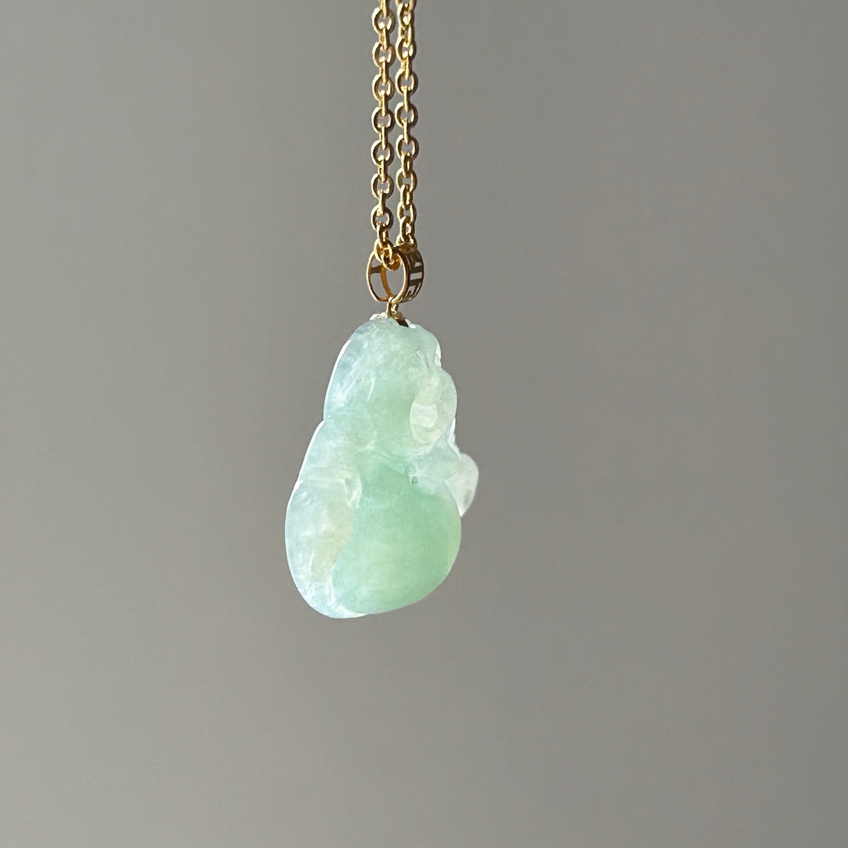 Apple Green Buddha Pendant - Lighter Colour on Model, photo 5 - Luxe Jadeite