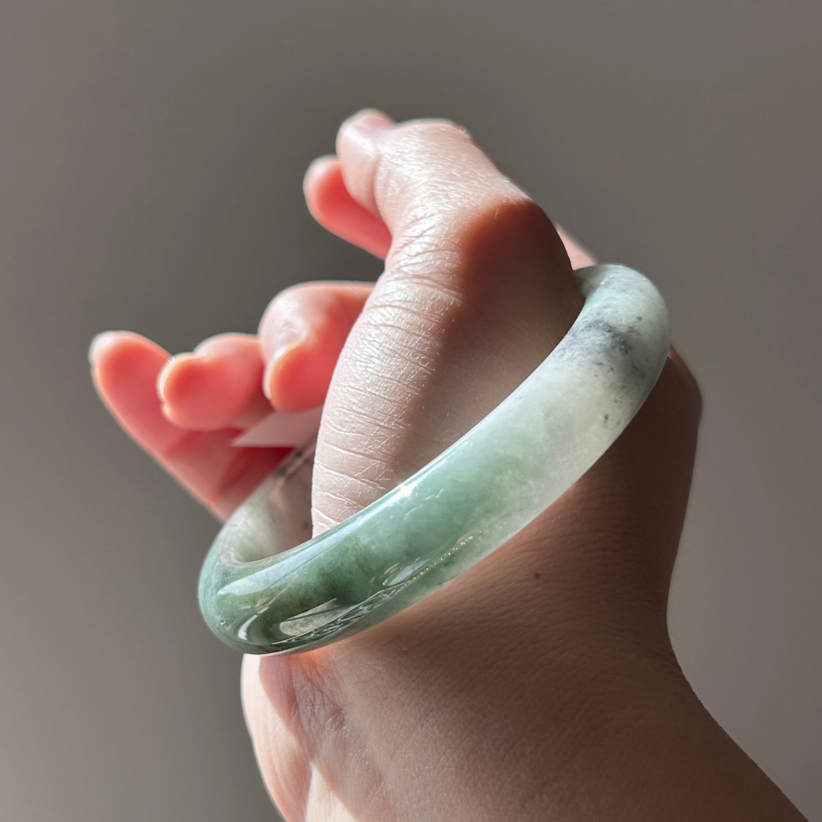 Floating green Burmese jadeite bangle with black chicken (wuji), 58.6mm, photo 4 - Luxe Jadeite