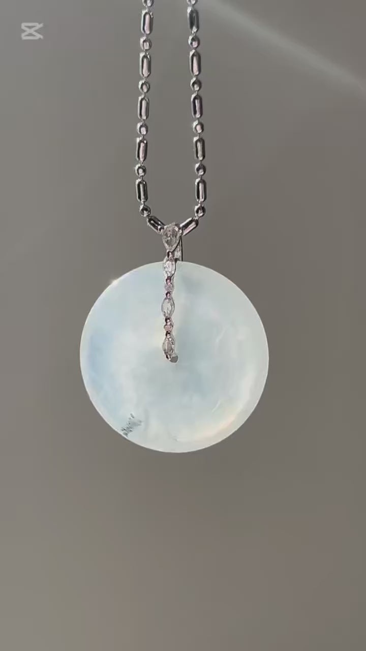 Icy white jadeite ping an kou pendant with floating wuji in 18k gold, video 2 - Luxe Jadeite